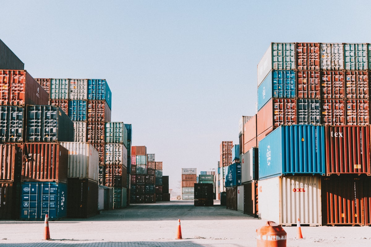 Stacked shipping containers at an industrial logistics site